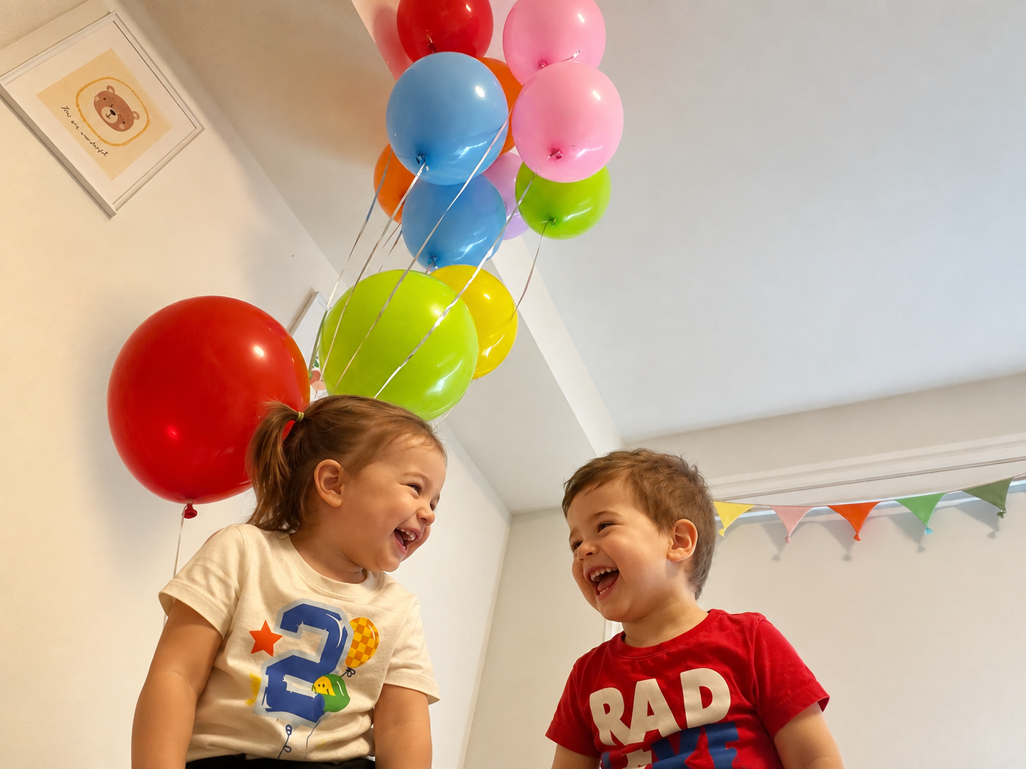 Two friends celebrating with balloons